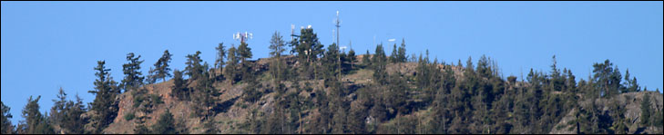 photo of antennas on timbered hilltop