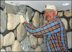 photo of david christensen building river rock chimney