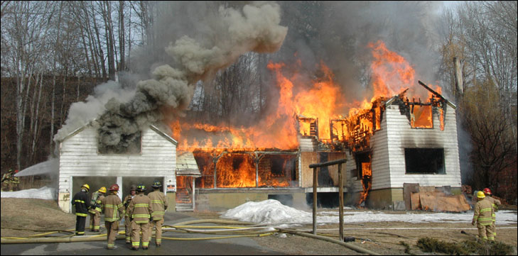 photo of big white winthrop house in flames