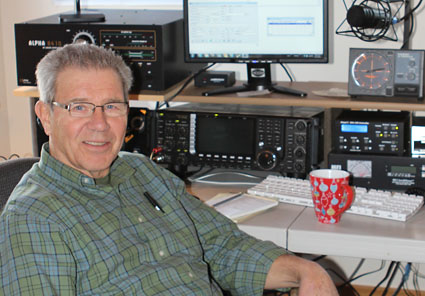 photo of older man sitting by radio equipment