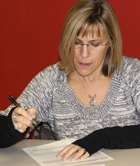 photo of woman taking written test