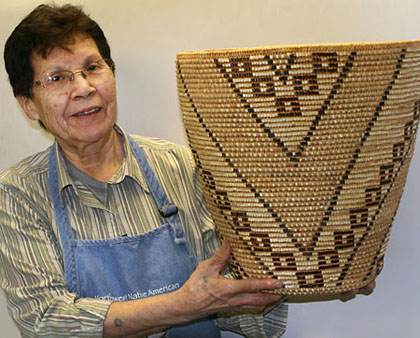 Photo of elaine timentwa emerson holding woven basket